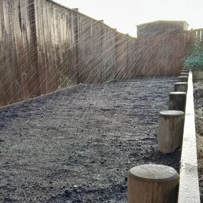 The sprinkler running over the newly sown lawn